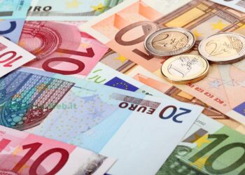 Different euro banknotes and coins