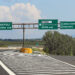 italian road signs on motorway near Rome City and the arrows directions to Naples and more cars